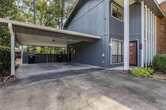 view of vehicle parking with a carport