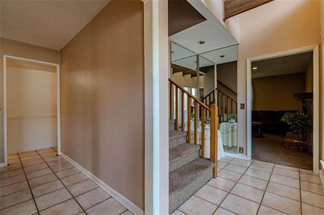 interior space featuring tile patterned flooring and a textured ceiling