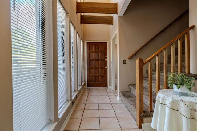 doorway to outside featuring light tile patterned floors