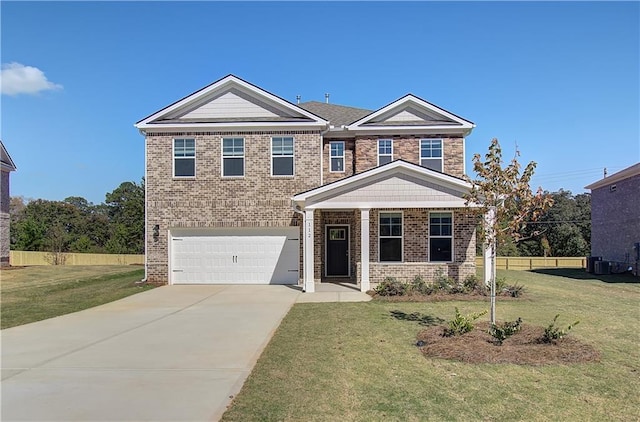 view of front of house with a garage and a front lawn