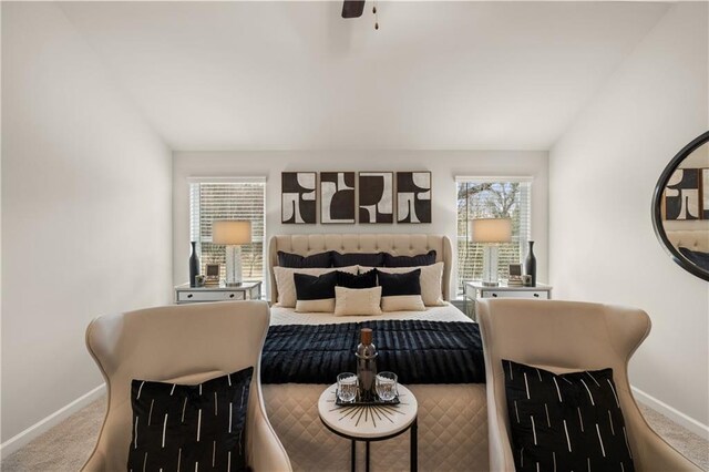 carpeted bedroom with ceiling fan and lofted ceiling