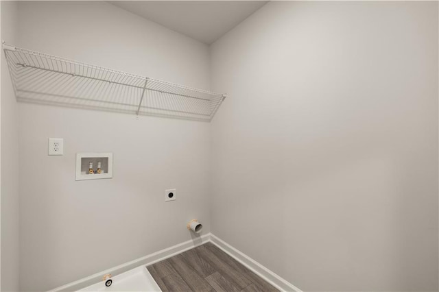 laundry area featuring hardwood / wood-style flooring, gas dryer hookup, hookup for a washing machine, and hookup for an electric dryer