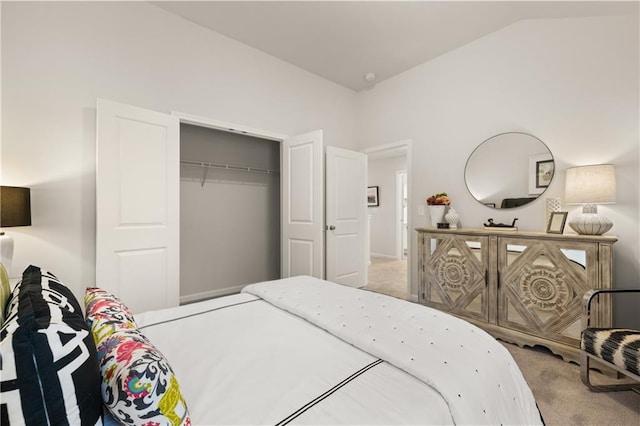 bedroom featuring carpet floors, a closet, and lofted ceiling