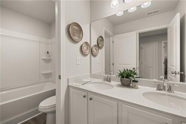 full bathroom with toilet, vanity, shower / bathing tub combination, and hardwood / wood-style flooring