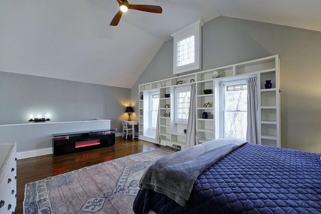 bedroom featuring baseboards, high vaulted ceiling, wood finished floors, and a ceiling fan