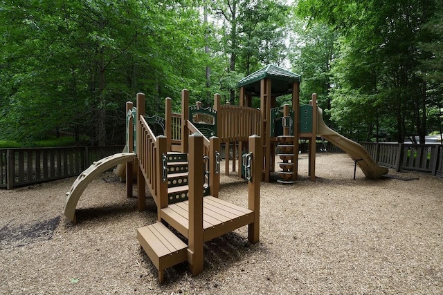community jungle gym featuring fence
