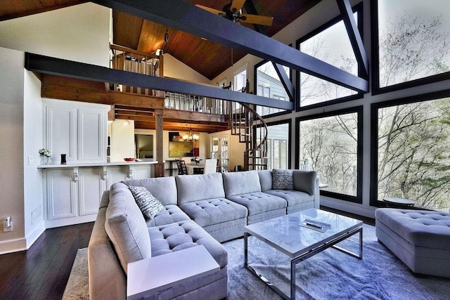 living room featuring beamed ceiling, dark wood-style flooring, high vaulted ceiling, and a chandelier