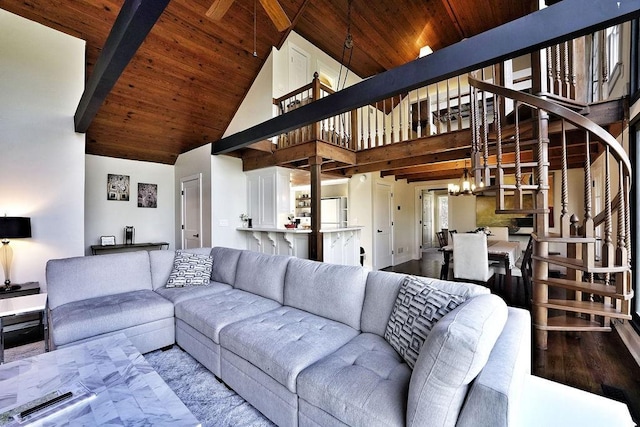 living area with stairs, wooden ceiling, high vaulted ceiling, a notable chandelier, and wood finished floors