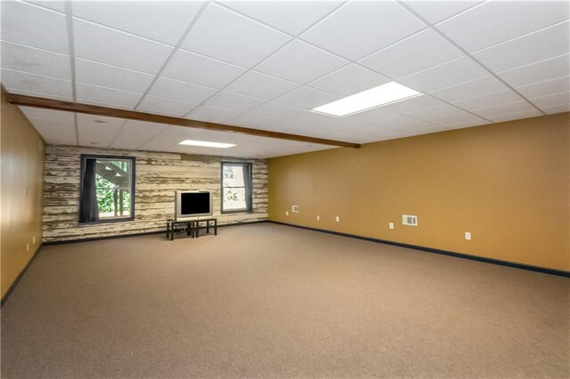 basement with carpet and a drop ceiling