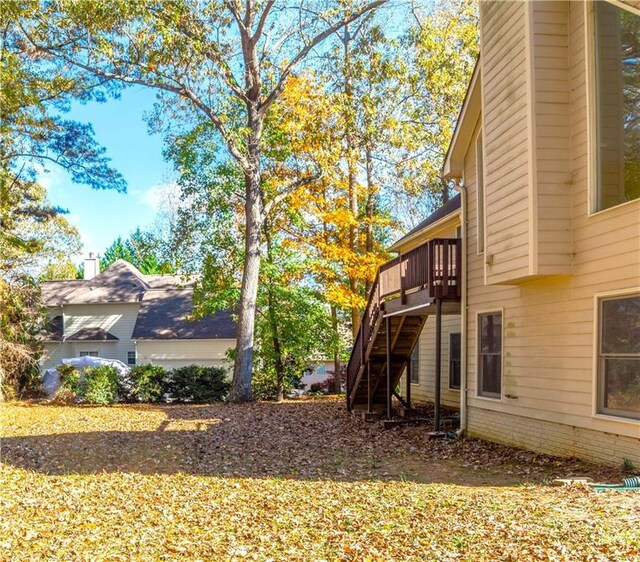 view of side of home featuring a deck