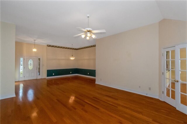 unfurnished living room featuring ceiling fan and wood-type flooring