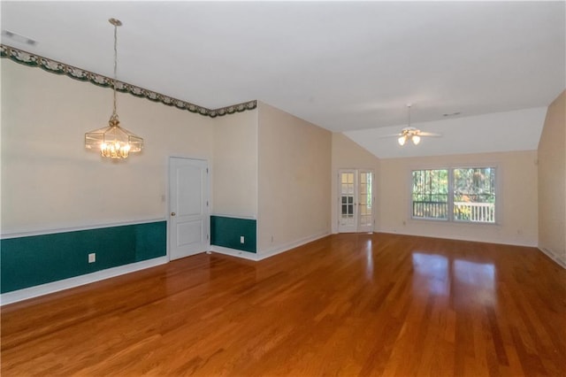 spare room featuring vaulted ceiling, ceiling fan, and hardwood / wood-style flooring