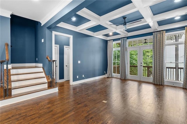 empty room featuring french doors, ceiling fan, coffered ceiling, and beam ceiling