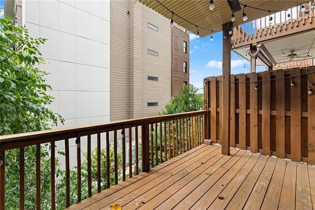 wooden terrace featuring ceiling fan