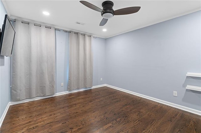 spare room with hardwood / wood-style flooring and ceiling fan