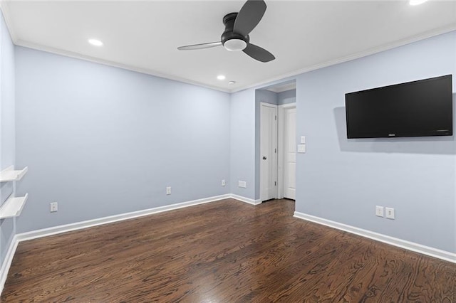 spare room with ornamental molding, dark hardwood / wood-style floors, and ceiling fan