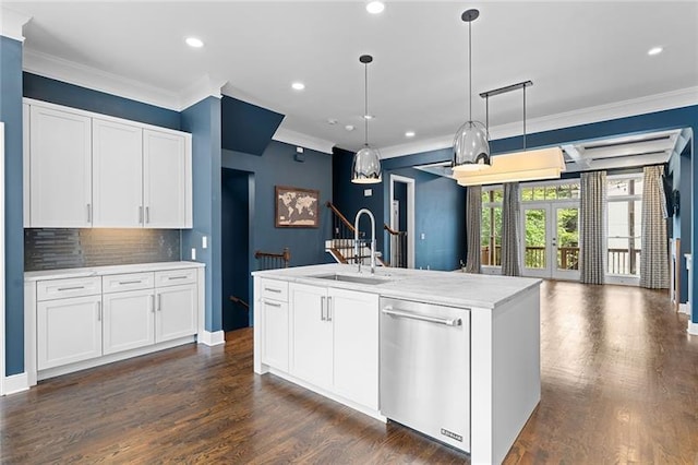 kitchen featuring white cabinetry, sink, a kitchen island with sink, and stainless steel dishwasher