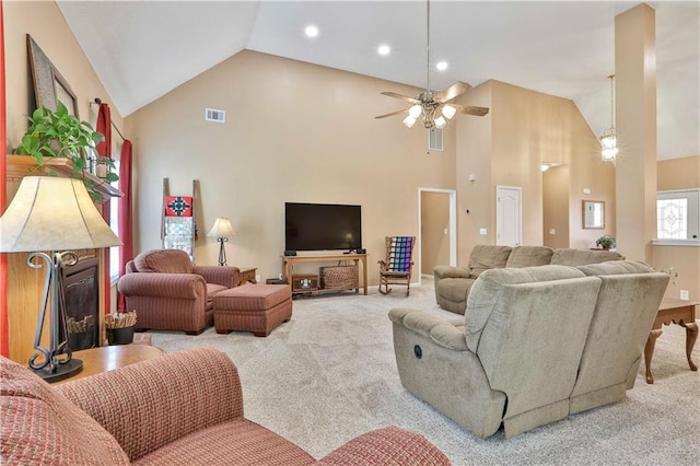 carpeted living room featuring high vaulted ceiling and ceiling fan