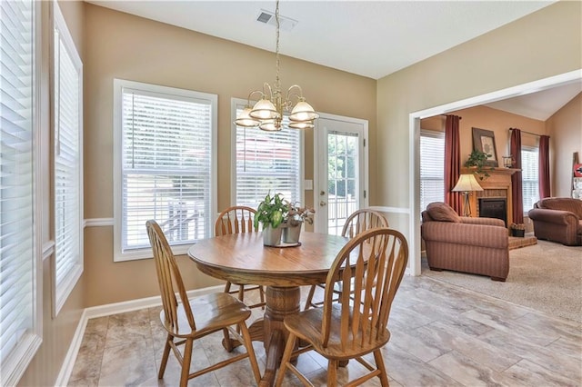 dining space featuring a notable chandelier