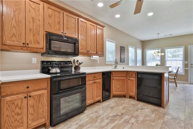 kitchen with sink, hanging light fixtures, kitchen peninsula, ceiling fan with notable chandelier, and black appliances