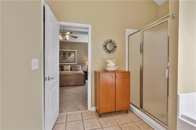 bathroom with ceiling fan, tile patterned floors, and separate shower and tub