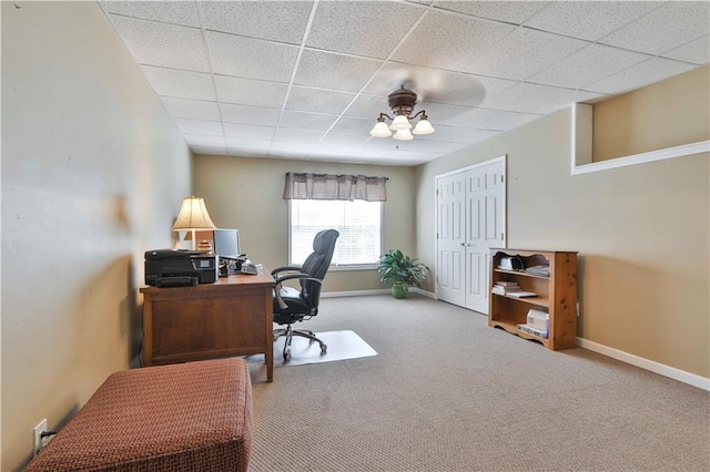 office area with a paneled ceiling and carpet flooring