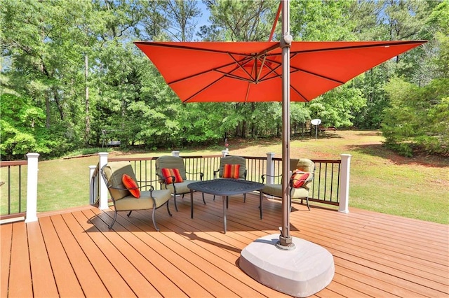 wooden deck with a lawn