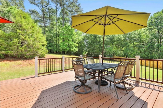 wooden deck with a lawn