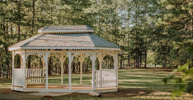 surrounding community with a gazebo and a lawn