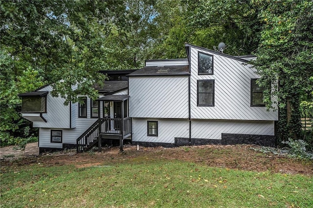 exterior space with a front lawn and a sunroom