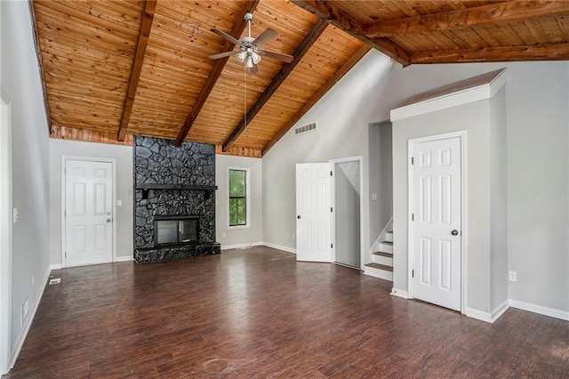 unfurnished living room with a fireplace, beam ceiling, ceiling fan, and wood ceiling