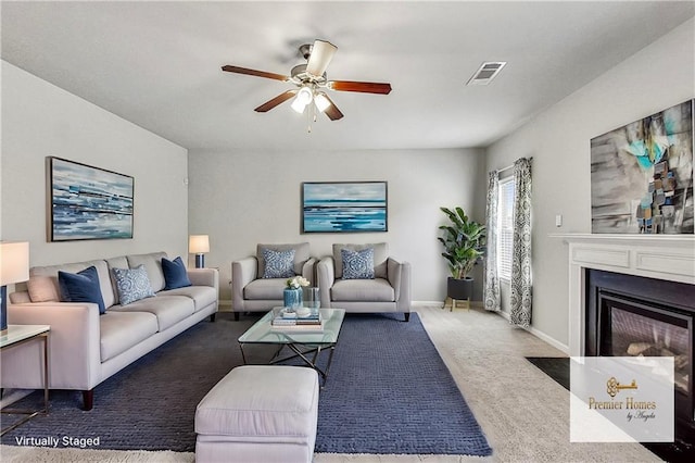 living room featuring ceiling fan and carpet flooring