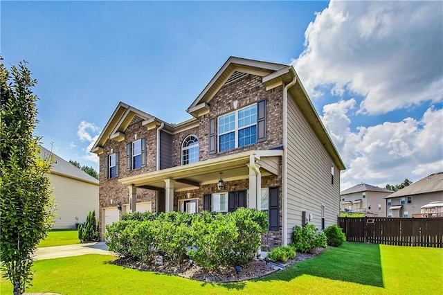 craftsman-style house with a garage and a front lawn