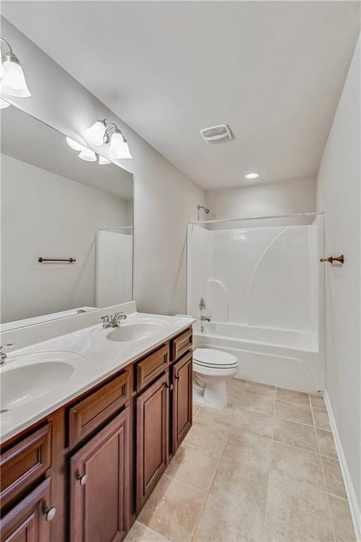 full bathroom with shower / tub combination, vanity, tile patterned flooring, and toilet