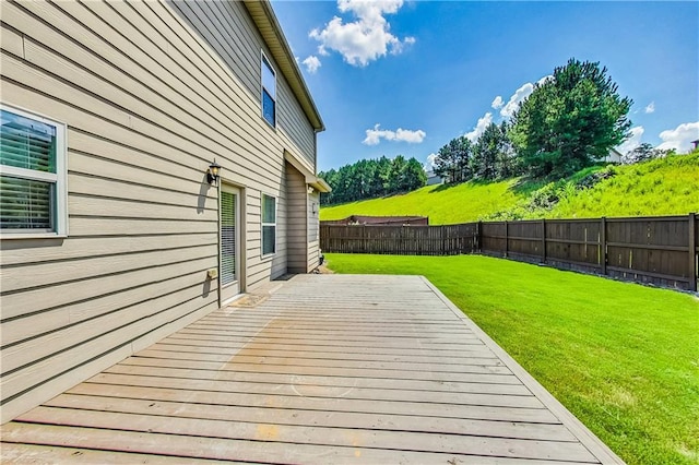 wooden terrace with a yard