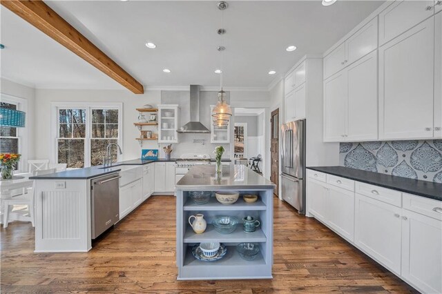 kitchen featuring stainless steel appliances, open shelves, dark countertops, and wall chimney exhaust hood