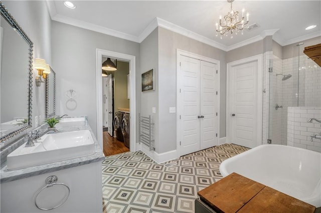 full bath with washing machine and dryer, a stall shower, tile patterned floors, a closet, and a chandelier