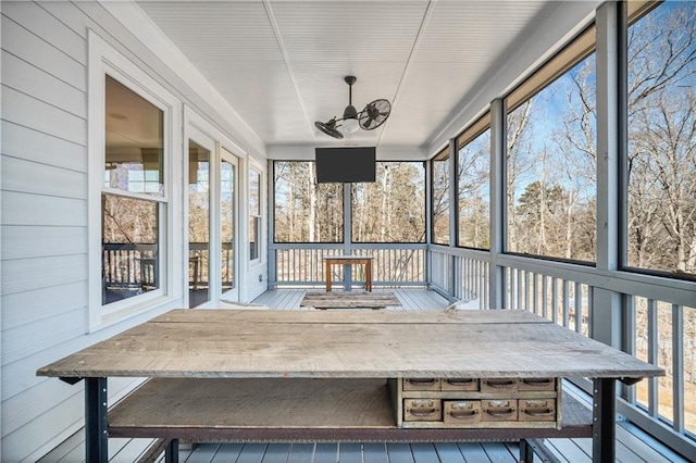 sunroom with outdoor dining space