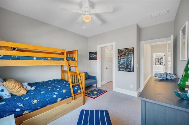 carpeted bedroom featuring a ceiling fan, baseboards, and visible vents