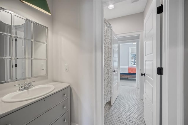 full bath featuring vanity and tile patterned floors