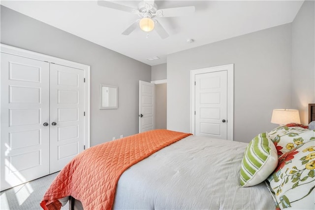 bedroom with carpet floors, ceiling fan, and a closet
