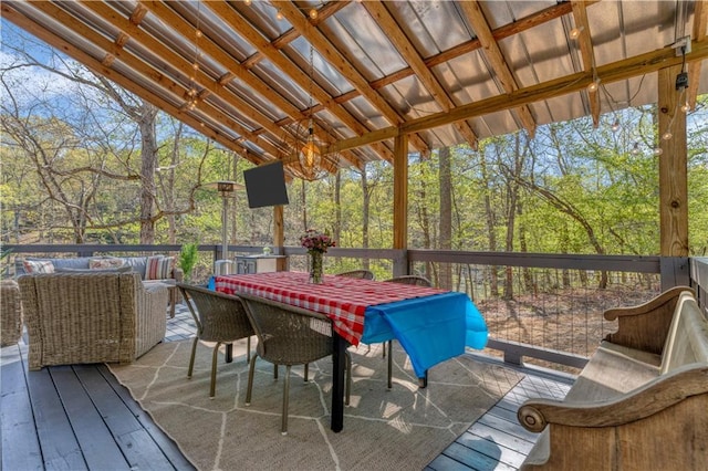 wooden deck featuring an outdoor hangout area and outdoor dining space