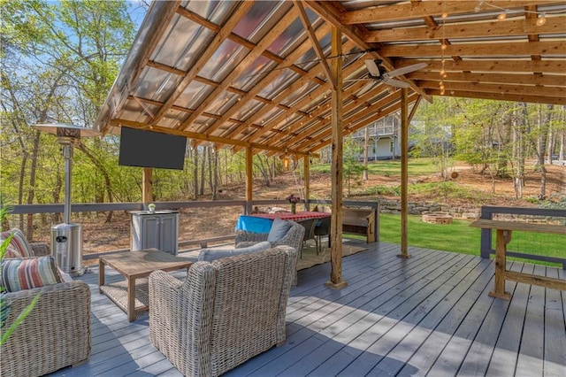 wooden deck featuring a fire pit and outdoor dining space