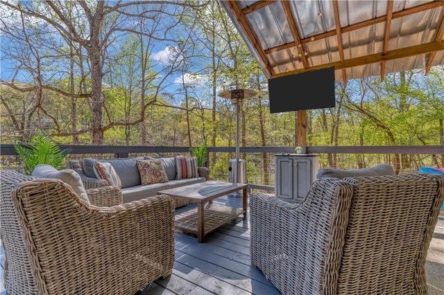 wooden terrace with outdoor lounge area