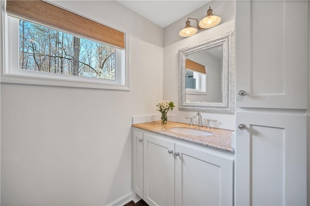 bathroom with vanity and a healthy amount of sunlight