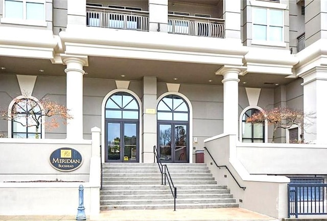 property entrance with a balcony