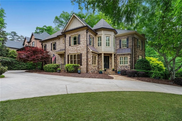 2260 Wood Falls Dr, Cumming, GA 30041 - view of front of home featuring a front lawn and a standing seam roof