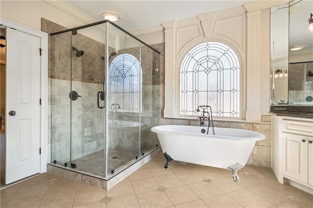 2260 Wood Falls Dr, Cumming, GA 30041 - bathroom featuring tile patterned flooring, a freestanding tub, visible vents, ornamental molding, and a stall shower