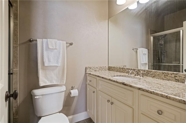 2260 Wood Falls Dr, Cumming, GA 30041 - bathroom featuring vanity, baseboards, a stall shower, and toilet
