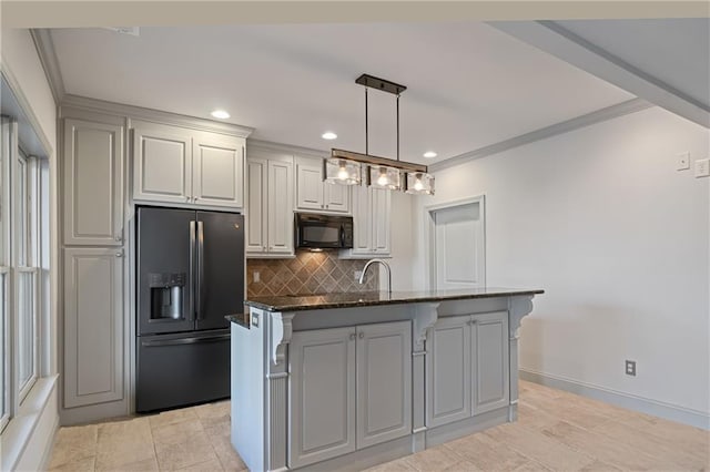 2260 Wood Falls Dr, Cumming, GA 30041 - kitchen with dark stone counters, recessed lighting, tasteful backsplash, pendant lighting, and black appliances